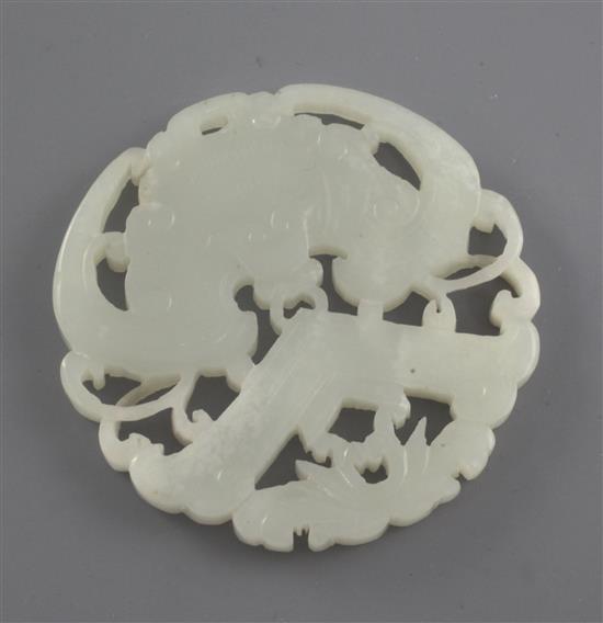 A Chinese white jade plaque, late 19th / early 20th century, diameter 5.6cm